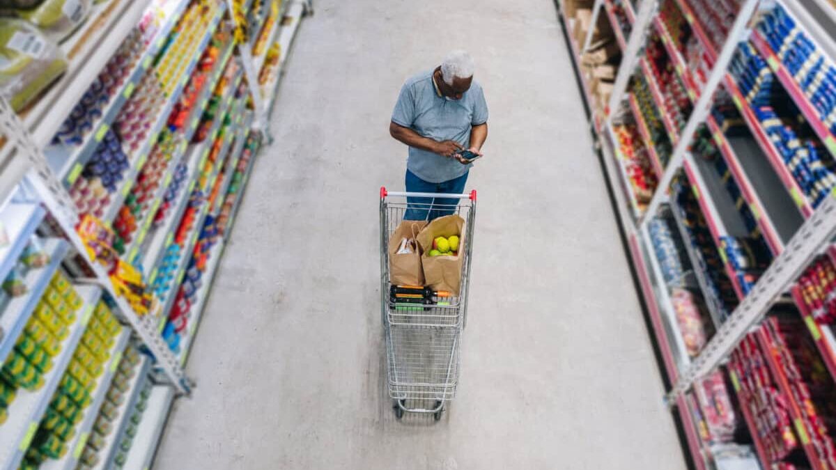 man shops at grocery store